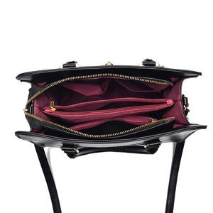 Large capacity black faux crocodile shoulder bag featuring red interior compartments