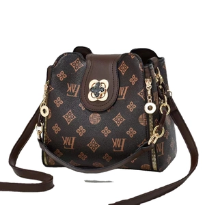 Brown monogram patterned shoulder bag with gold chain and adjustable leather strap