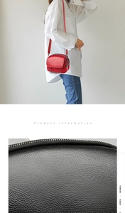 Detail of lychee textured leather crossbody bag with multiple zippers and long shoulder strap