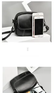 Three-layer black pebble leather crossbody bag showing internal storage capacity vs phone