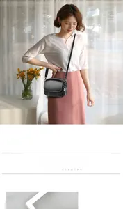 Black PU leather crossbody bag featuring three-layer zipper pockets and heart pendants