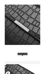 Close-up of black crocodile texture leather bag featuring magnetic closure and metal trim