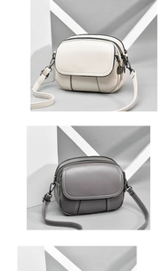 Close-up of triple zipper structure and premium matte hardware on PU leather crossbody bags