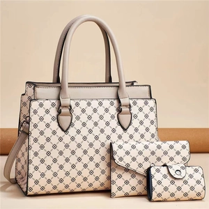 Detailed view of 3-piece bag set including tote and clutch with grid print
