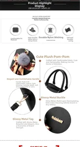 Détails du sac en cuir PU noir montrant les boucles en métal et le pompon gris doux