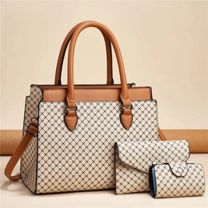 Three-piece women bag set with geometric print tote, crossbody clutch, and small wallet