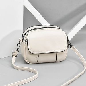 Three-layer beige PU leather crossbody bag with adjustable strap and metallic hardware