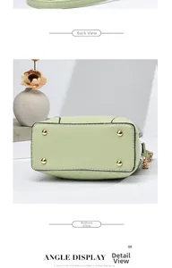 Détail de la base du sac seau vert clair avec quatre clous de protection en métal doré