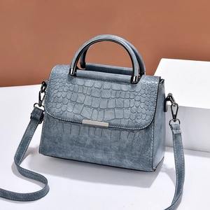 Gray-blue crocodile embossed leather handbag with metal accent and adjustable strap