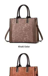 Dettaglio della borsa tote in pizzo vintage con cuciture laterali e manici in pelle