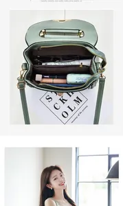 Internal layout of green crossbody bag showing three compartments and storage capacity