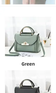 Detail of lychee textured leather handbags in green and black with round metal handles