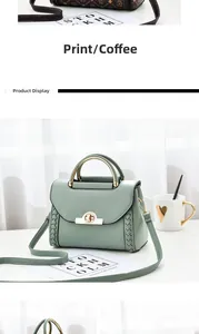 Detail view of stylish handbag with metal half-round handle and woven side accents