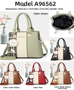 Detailed interior view of a contrast panel handbag showing multiple zipper compartments