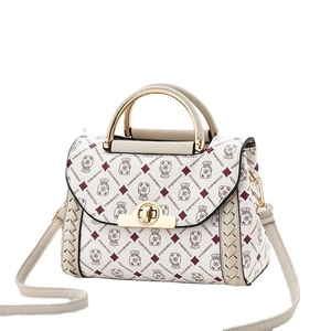 Chic beige crossbody bag with cartoon lucky bag print and golden metal handle