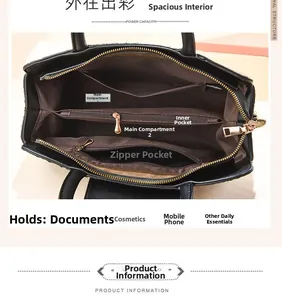Internal view of the black ostrich pattern bag showing large compartments and zipper pockets