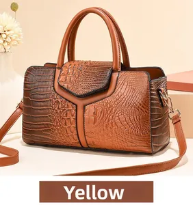 Detail of ostrich embossed texture on dark khaki large capacity handbag with Y-shaped stitching
