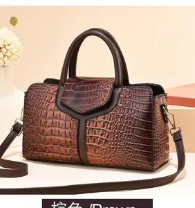 Close-up of brown ostrich texture and stitching on large capacity shoulder bag