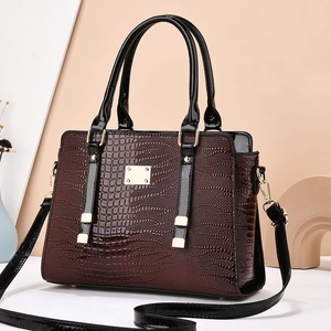 Elegant burgundy crocodile pattern handbag with gold hardware and black top handle