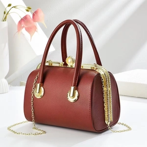 Dark red lychee pattern barrel bag with pearl clasp and golden chain strap