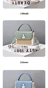 Close-up of tricolor square bag with wide BEAUTY 1987 strap and chain detail