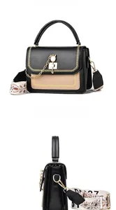 Front and side view of two-tone leather crossbody bag with chain and wide strap