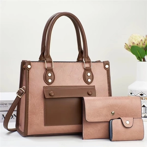 Three-piece retro textured tote bag set with metal rivets and adjustable strap