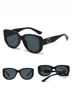 Detailed views of black square sunglasses featuring silver H-shaped metal temple accents