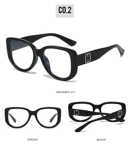 Detailed views of black cat-eye frames with silver H metal accent on temples