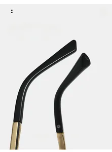 Detail of curved gold metal and black temples for comfortable anti-blue light glasses