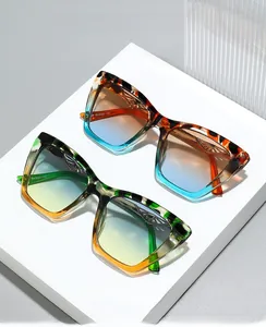 Detail view of cat-eye sunglasses with tortoiseshell patterns and gradient lenses
