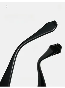 Macro shot of curved black glossy temple tips designed for ergonomic comfort and fit