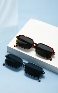 Detail of square frame sunglasses in tortoise shell and navy blue with metal hinges