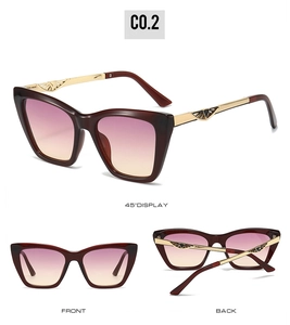 Detail view of cat-eye sunglasses with gradient lenses and hollow metal wing temples