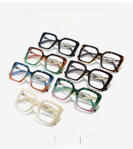 Detailed close-up of square glasses frames in multiple colors with gold metal temples