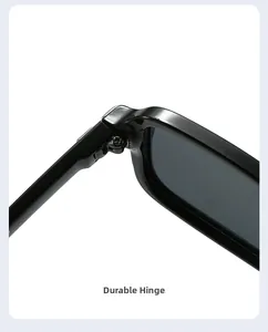 Detail view of the sturdy metal hinge and glossy frame on these square sunglasses