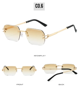 Detail view of rimless gradient brown sunglasses with gold metal C-hinge temples