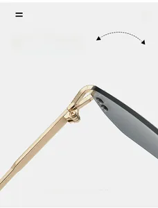 Macro detail of a durable gold metal hinge on rimless sunglasses for smooth folding