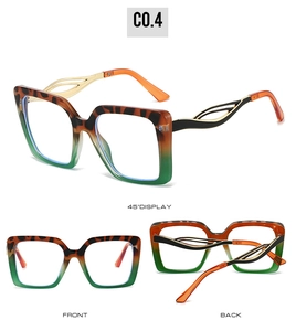 Detail view of square leopard and green frames with hollow metal temples and orange tips