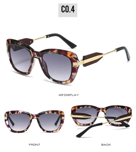 Detail of tortoise shell frame sunglasses with gradient lenses and golden metal temples