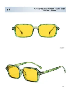 Detail view of square sunglasses featuring green patterned frames and yellow lenses