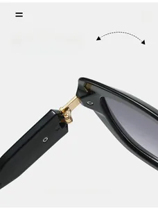 Macro shot of durable golden metal hinge on black cat-eye sunglasses frame for stability