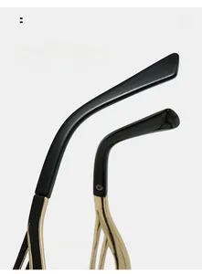 Detail of curved ergonomic temple arms with golden metal hinges for square glasses