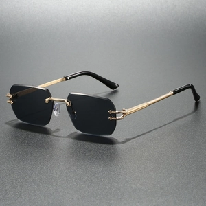Polygonal rimless sunglasses with grey lenses and gold metal C-shaped hinges