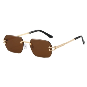 Octagonal rimless sunglasses with brown lenses and golden metal engraved temples