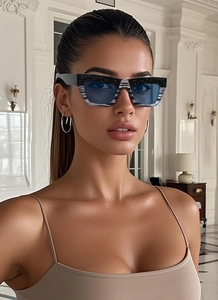 Chic cat eye oversized sunglasses with black and white textured frames and blue lenses