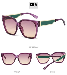 Detail view showing purple frame sunglasses with yellow gradient lenses and green accents
