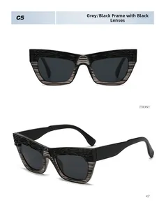 Close-up of square cat-eye sunglasses with grey wood grain texture and dark lenses