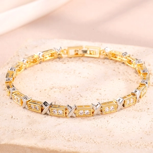 Luxury gold and silver X-link bracelet with pave-set zircons on textured stone