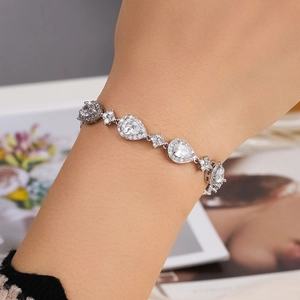 Elegant silver teardrop zircon bracelet for women featuring delicate cross flower charms